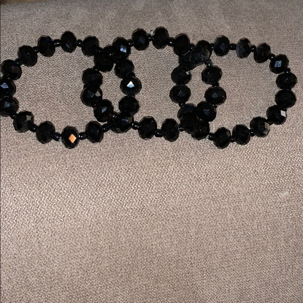 Black beaded bracelets.